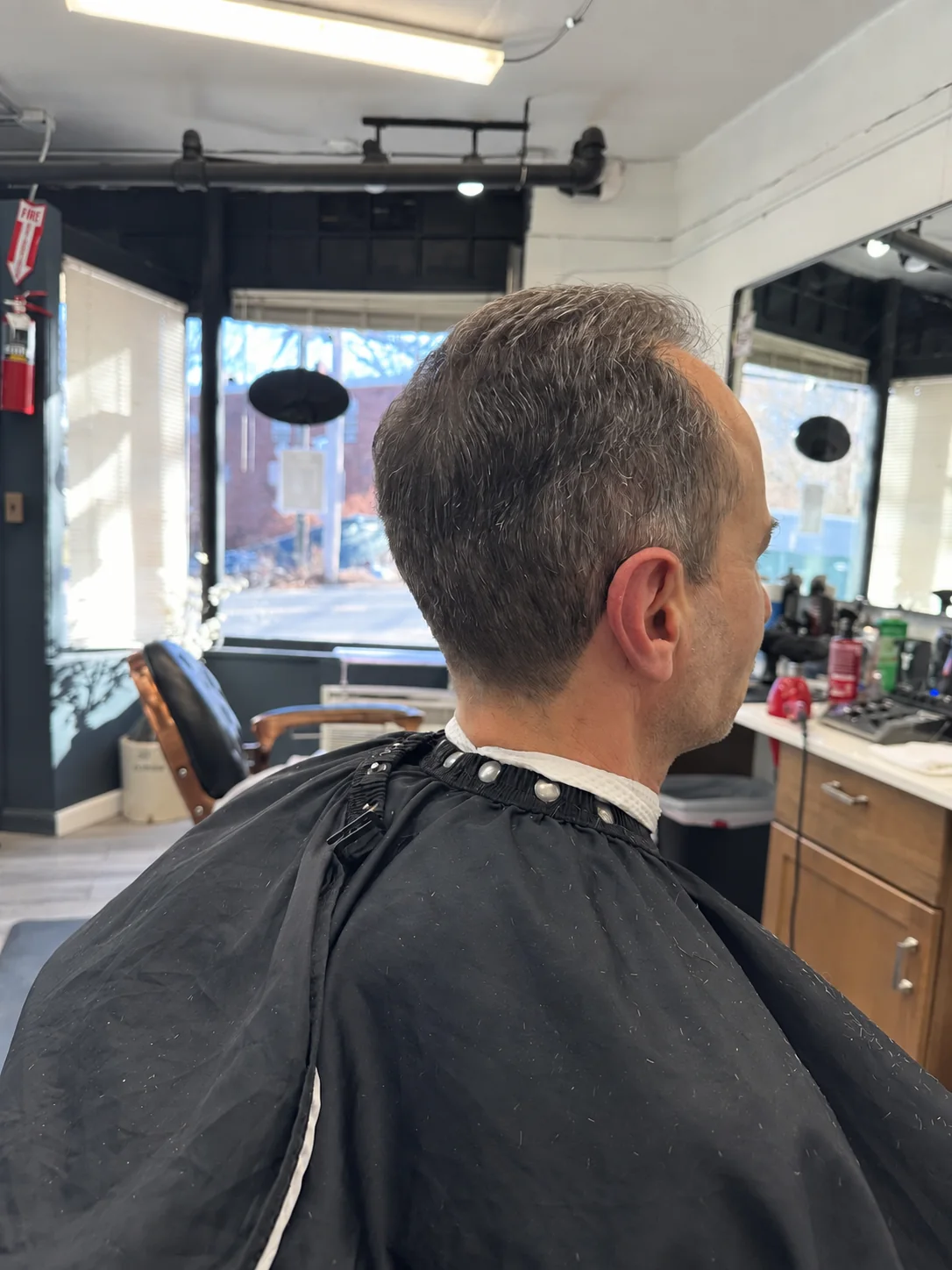 Rear three-quarter view of a finished classic haircut