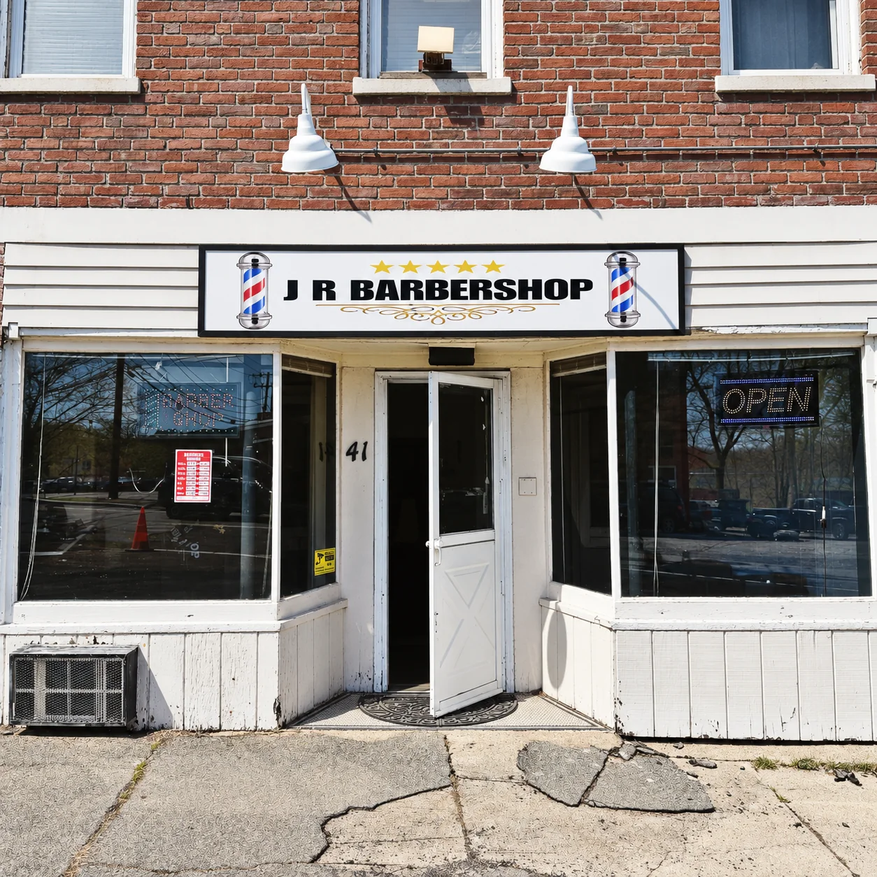 JR Barbershop sign and welcoming storefront