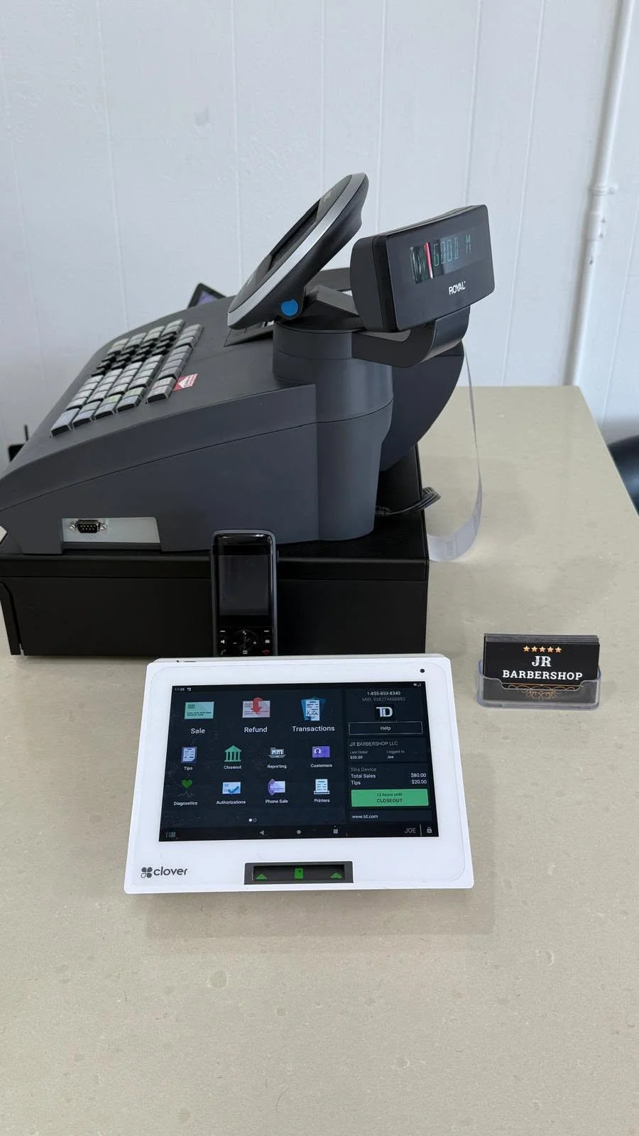 Reception counter with a register, tablet and JR business cards