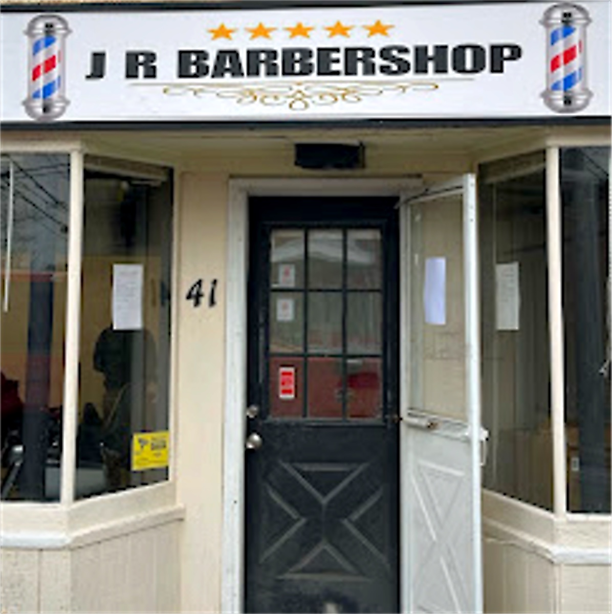 JR Barbershop storefront sign